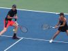 Tennis: How to Choose a Doubles Partner Jamie Murray with a racket on a tennis court holding a racquet