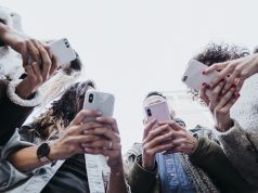 Definition Of Followers Is Quite Simple And Understandable A group of people looking at a cell phone