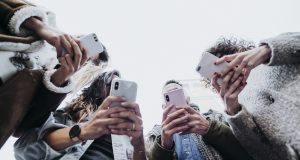 Definition Of Followers Is Quite Simple And Understandable A group of people looking at a cell phone