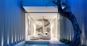 Valuable Ideas for Small House Plans A room with a pool in front of a building