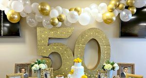 How demanding are the 50th-anniversary gifts!! A vase of flowers on a table