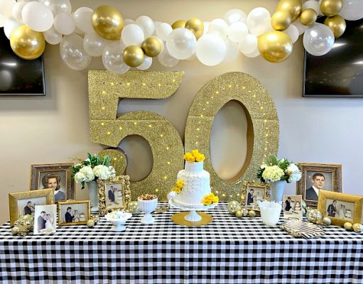 How demanding are the 50th-anniversary gifts!! A vase of flowers on a table
